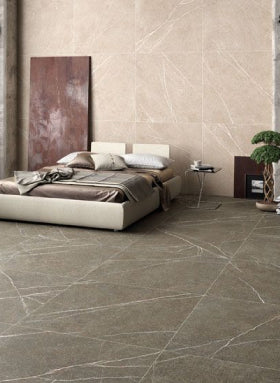 Stone effect wall and floor tiles in bedroom