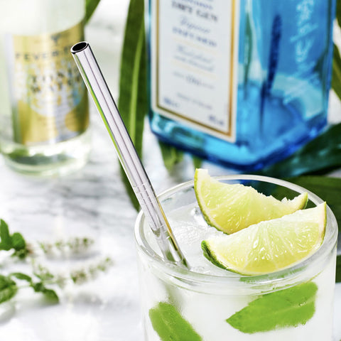 Lemonade in a glass with reusable straw