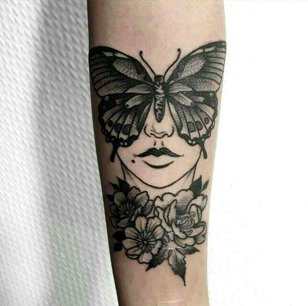 Tatouage Papillon en forme de visage sur avant bras - Rêve de Papillon