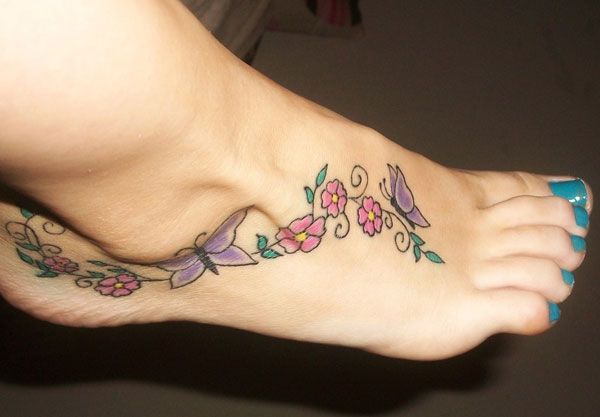 Tatouage Papillon sexy avec fleur sur Pied - Rêve de Papillon