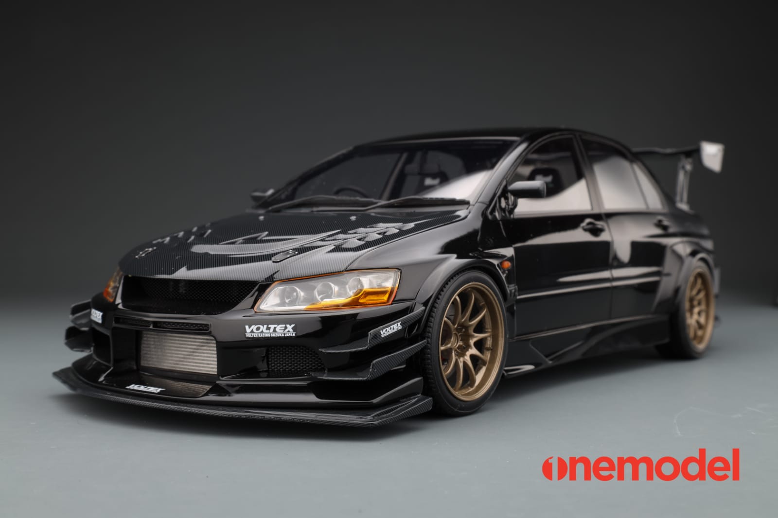 One Model 1:18 Mitsubishi Lancer Evolution IX Voltex with Carbon Bonnet in  Black