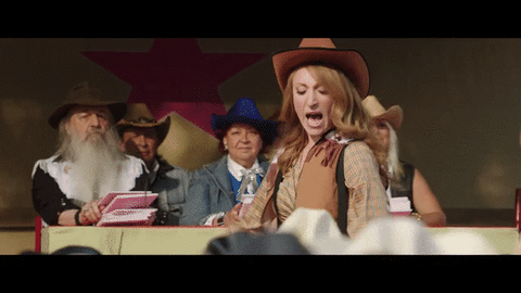 GIF of a woman pretending to be a cowgirl