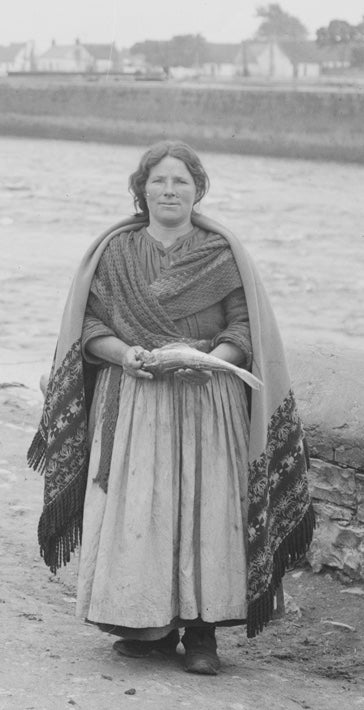 Woman wearing a traditional Galway Shawl in Ireland