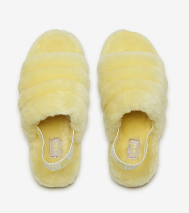 yellow fluffy ugg slides