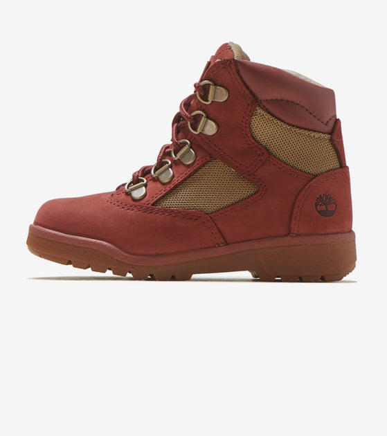 red and black timberland field boots