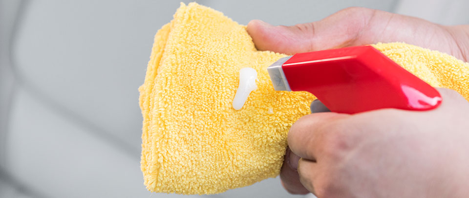 spraying a towel