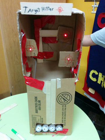 Target Hitter. A cardboard arcade game with an automatic ball return and light up targets.