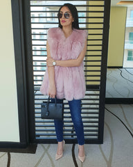 gorgeous lady standing in hallway wearing Furever amsterdam pink faux fur vest