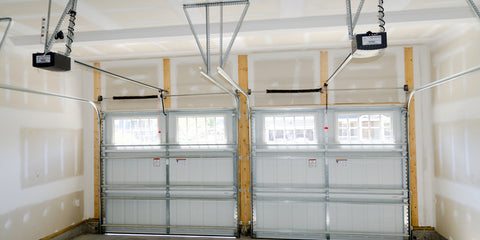 Garage doors with installed weatherstripping