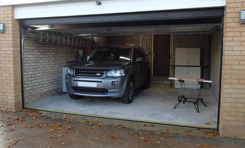 Clean garage with an installed garage door threshold seal