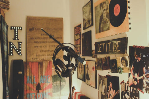 Microphone placed in a garage with photos of the Beatles