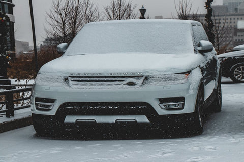 A range rover covered in snow
