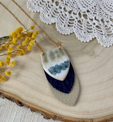 Flourish Stoneware necklace with gold, block leather and a ceramic blue, tan and white painted pendant