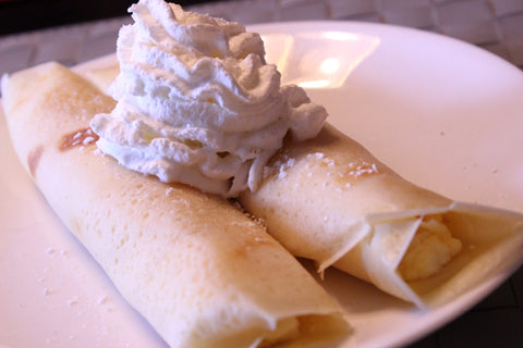 crepes with filling and whipped cream