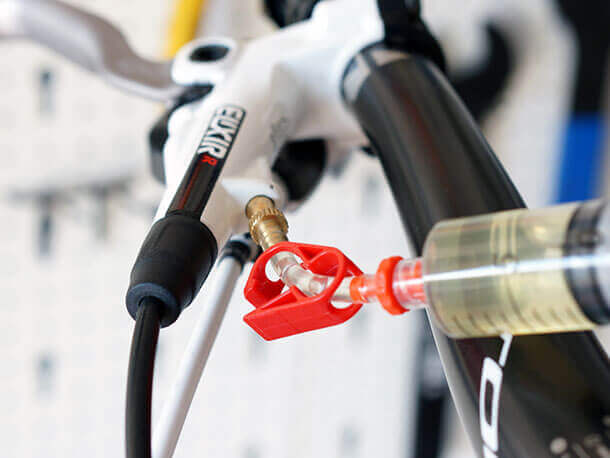 avid bleed kit syringe fitted to master cylinder
