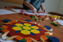 Kids Using Tangram Puzzles to Learn Shapes image PuzzleMode