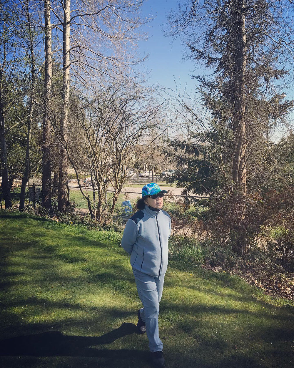 SPITGAN WEBZINE #3 Photo 3. Mom wears STR3AK CLothing tie dye cap walking on the Langara Golf Course, Vancouver, BC 
