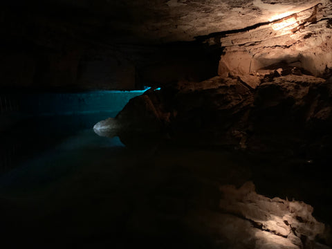 boat tour inside through binkley cave system within indiana cavern