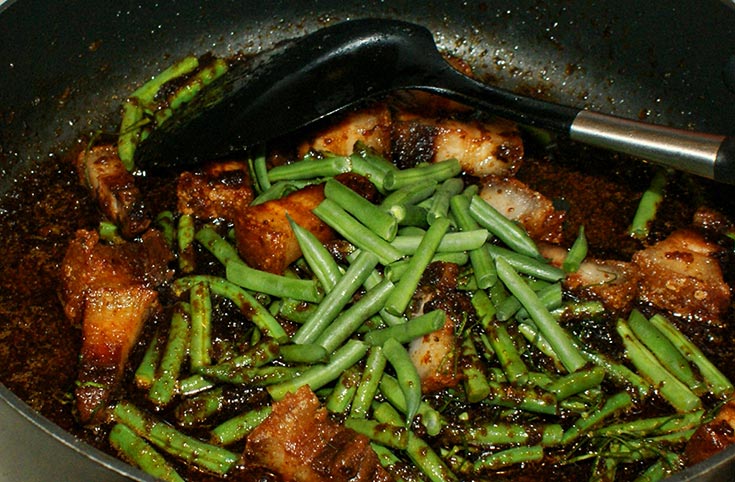 Crispy Pork Belly in Red Curry Paste Add pork and beans to curry paste