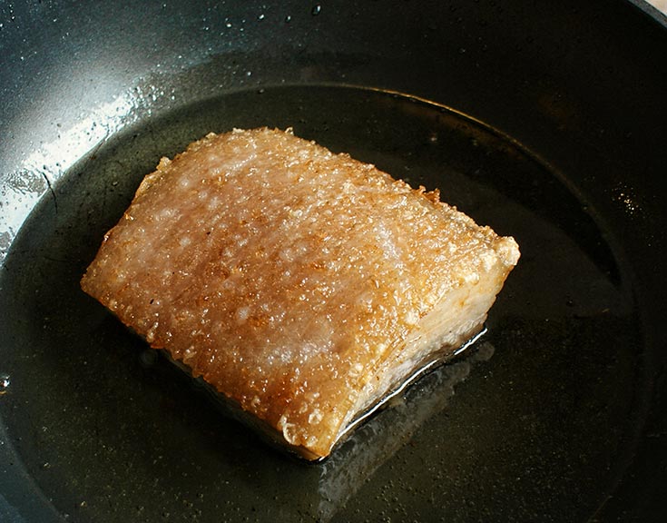 Crispy Pork Belly in Red Curry Paste Fry pork skin side up