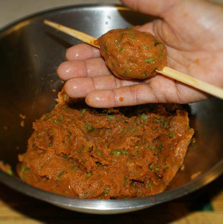 Forming Thai fish balls for grilling
