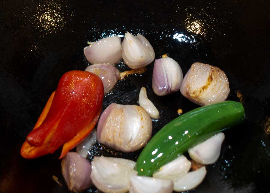 Saute shallots and chillies