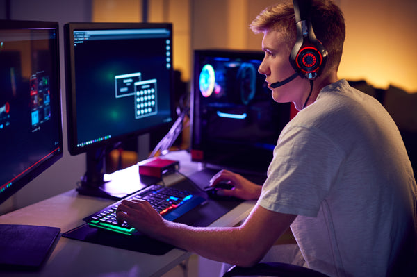 Gamer sitting posture in front of battlestation