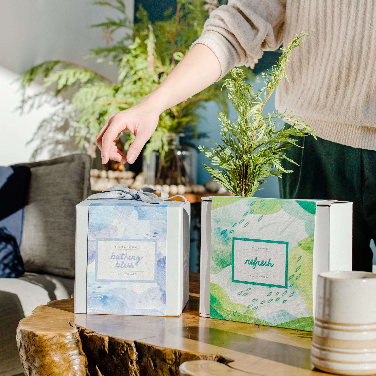 All-natural, made in Canada gift sets from Rocky Mountain Soap Company placed on a table as part of a holiday gift exchange like Secret Santa, White Elephant, or Draw Names. 