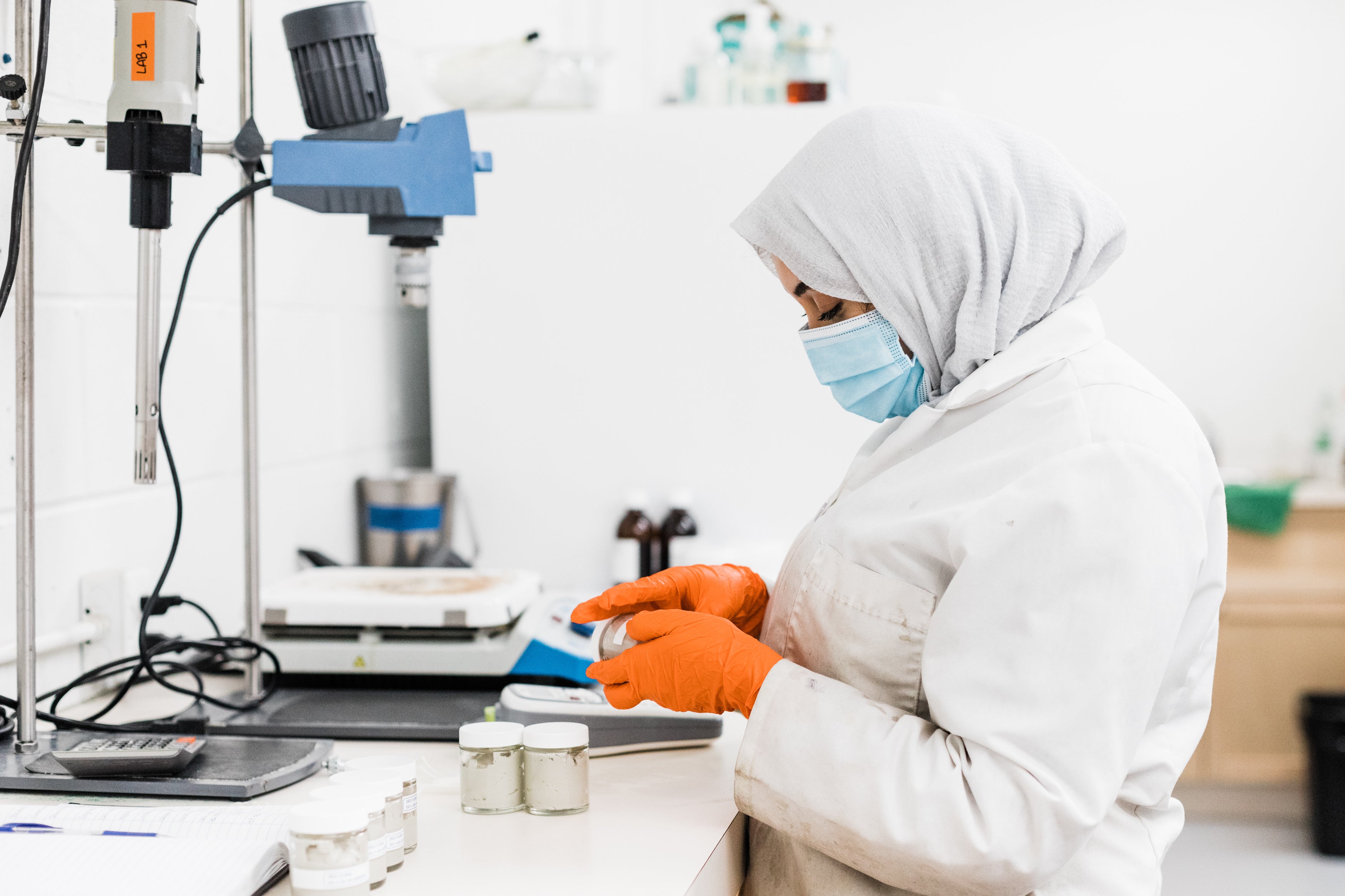 Image of woman wearing a hijab working in lab. 