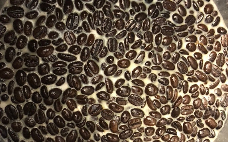 Death Wish coffee beans in a mixture of heated milk and cream