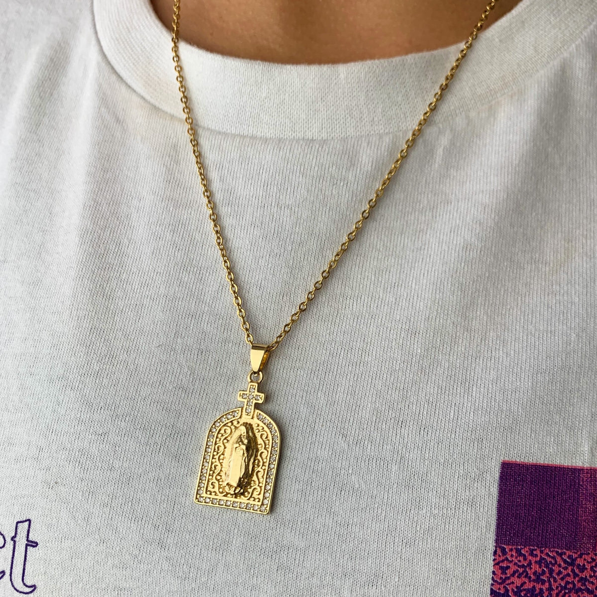 supreme justice gold pendant