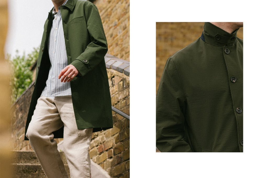 A model wearing Oliver Spencer's Marsh Green Grandpa coat and beige trousers.