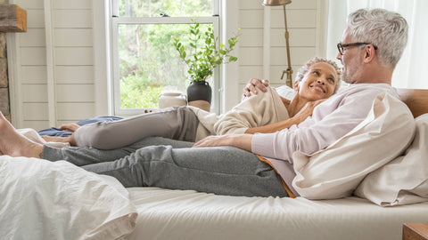 couple smiling on the bed