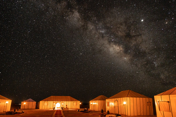 Milky way in night sky at luxury desert camp in Erg Chebbi outside of Merzouga with Kantara Tours