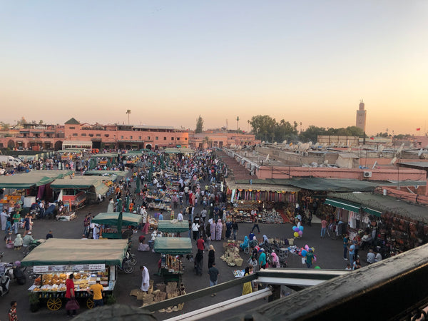 Visiting Marrakech's Jmaa el Fna square, as seen from nearby restaurant terrace, on Kantara Tours Signature 12-day tour throughout Morocco