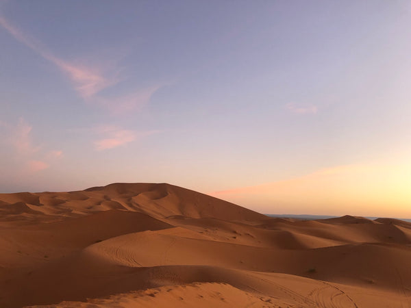 Kantara Tours takes clients on an overnight camel trek to luxury camp in Erg Chebbi dunes outside of Merzouga, Morocco