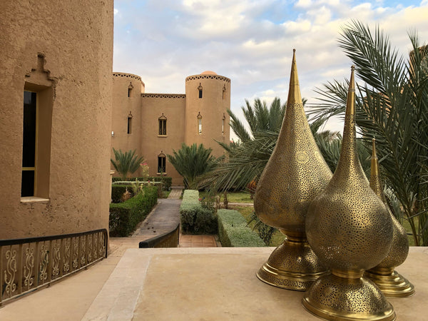 Moroccan brass lamps outside of Arfoud hotel near Morocco's Sahara desert on Kantara Tours custom tour