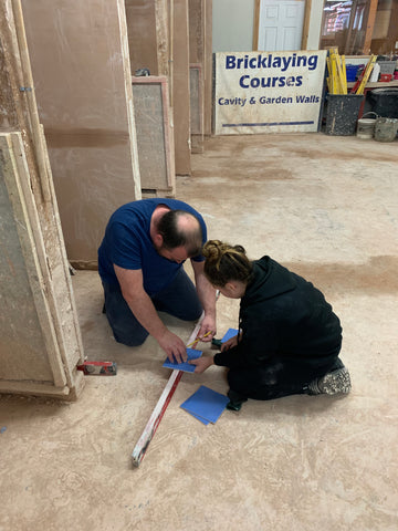 Dad and daughter tiling