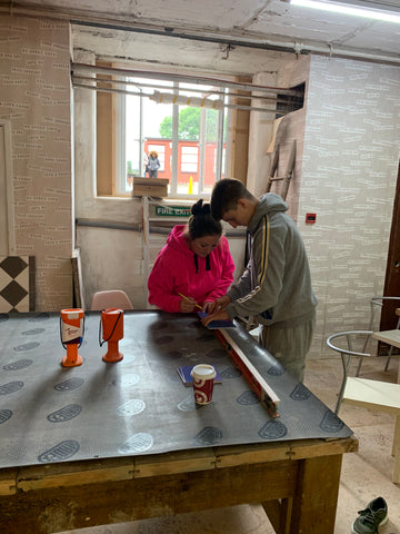 Mum and son tiling