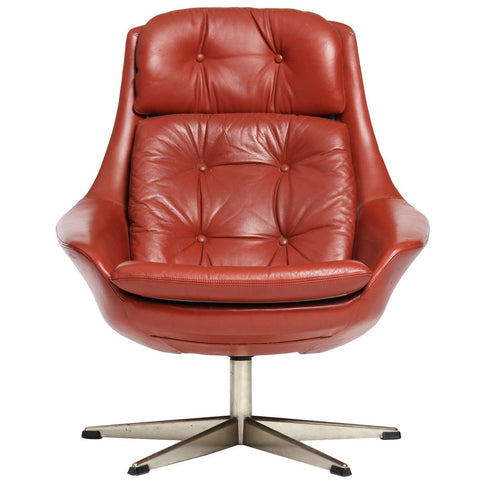 Red leather swivel armchair by H.W. Klein