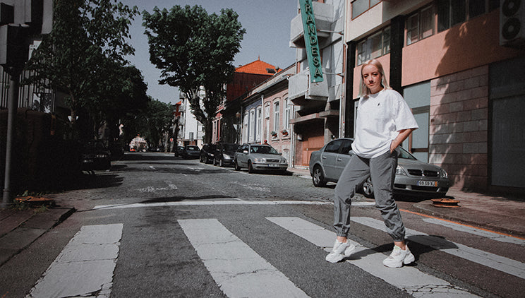 Woman wearing chunky vegan platform sneakers with a streetwear style outfit.