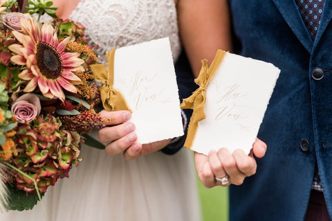 mustard silk ribbon on wedding vow books