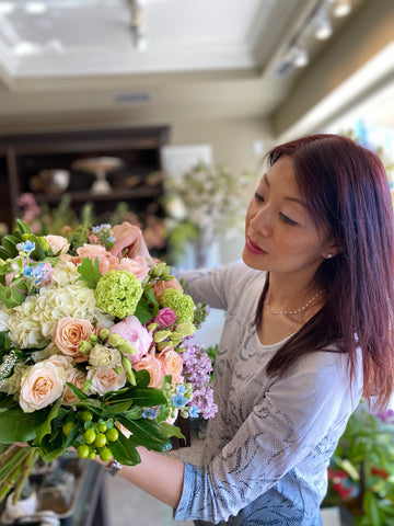 Designer Christine Liao with one of her fresh flower creations