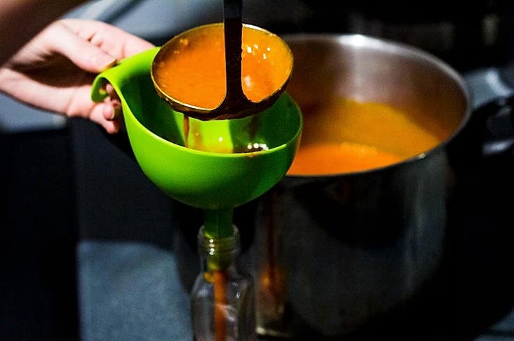 funnel hot sauce bottling