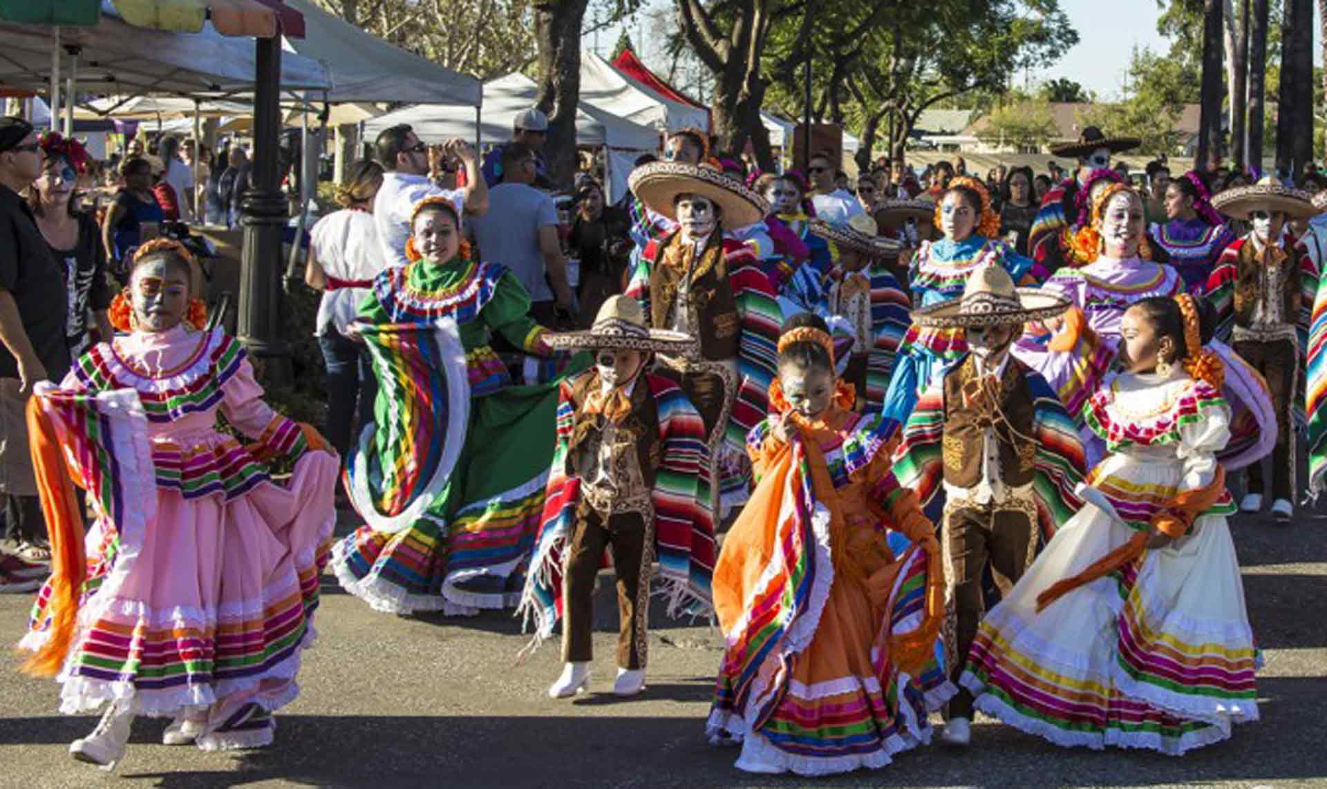 People in Costumes and Makeup Celebrating Dia De Los Muertos