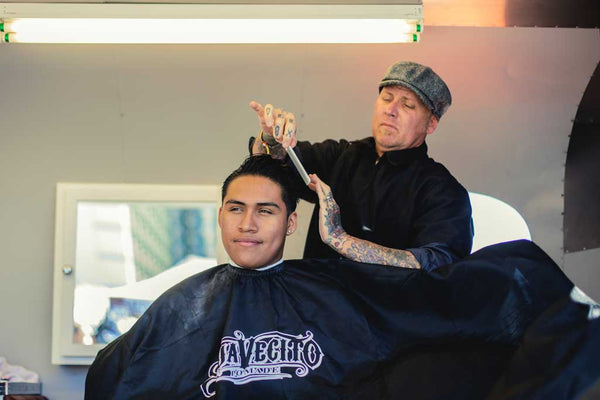 Barber combing hair