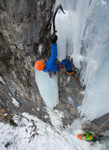 climbing an icy mountain face