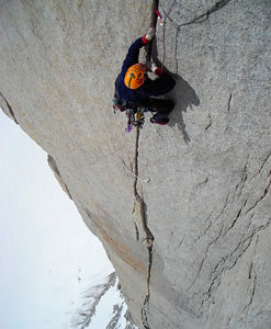 climbing a steep mountain face