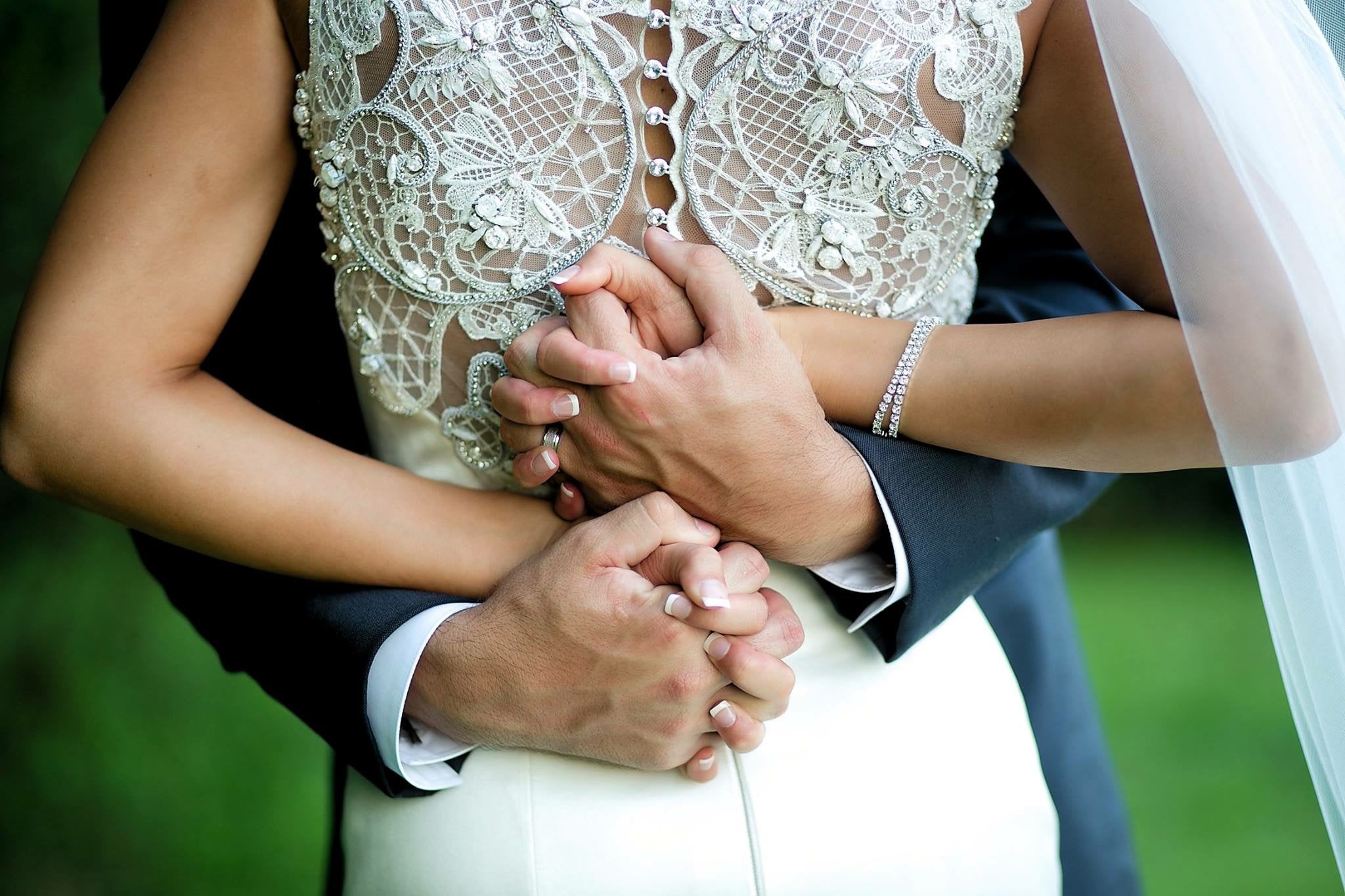 Wedding Couple Interlacing Hands