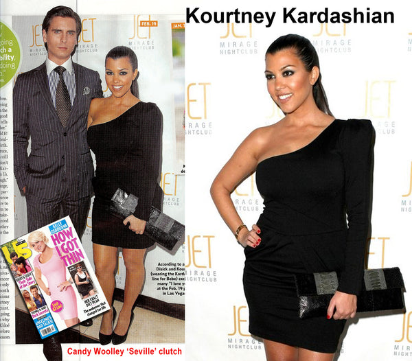Kourtney Kardashian with a Candy Woolley clutch at Dash fashion show in Vegas